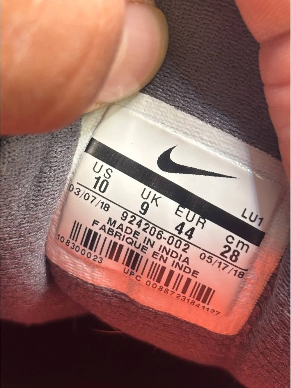 Nike legend trainer orange accents